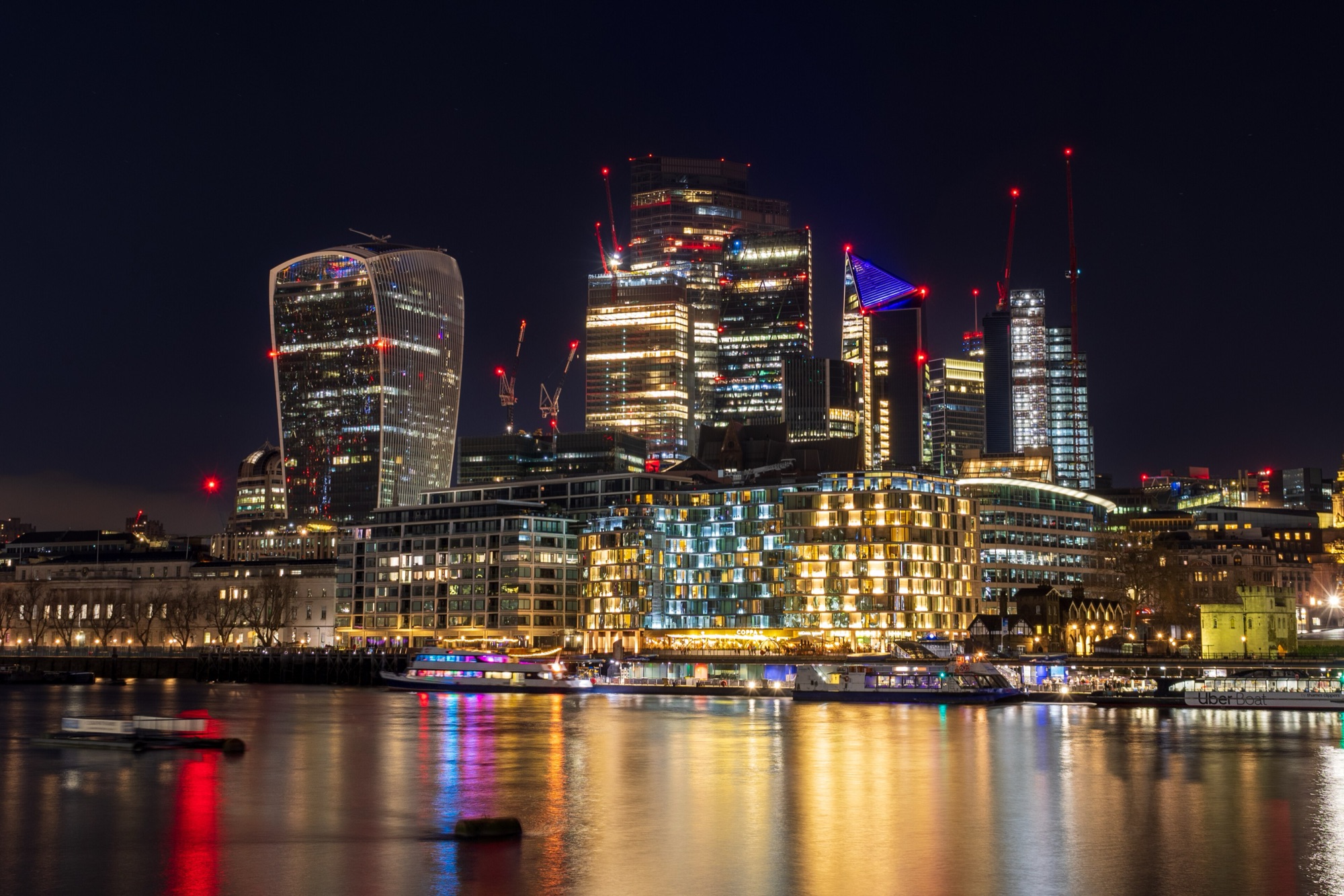 The City of London skyscrapers lit up at night