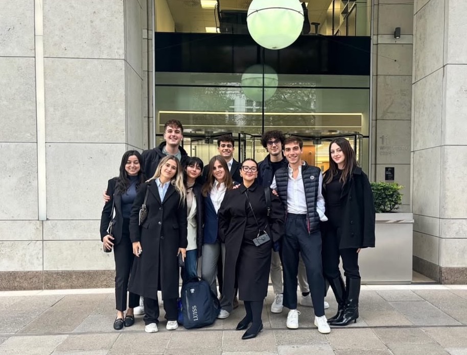 Members outside a firm in London's financial district